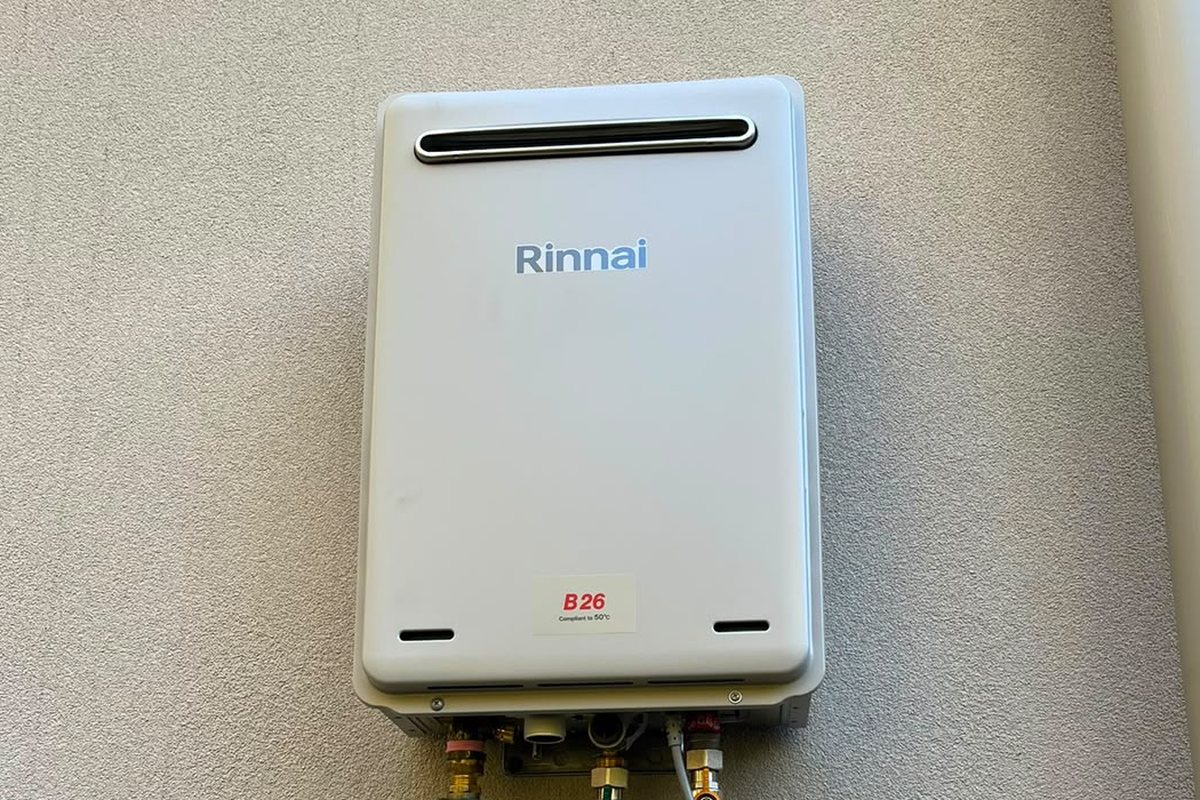 Rinnai continuous flow gas hot water unit installed on a Melbourne home exterior wall
